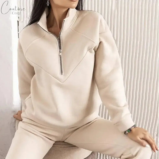 Fashionable beige hooded sweatshirt with zipper, perfect for casual and cozy looks in any season.
