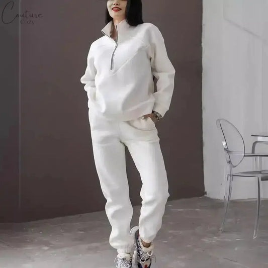 Fashionable beige hooded sweatshirt with zipper, perfect for casual and cozy looks in any season.