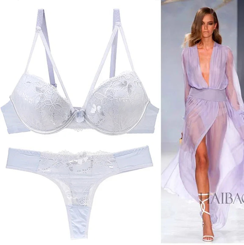 Light lavender lace bra and thong lingerie set beside runway model in matching sheer robe, stylish and elegant design for everyday comfort.