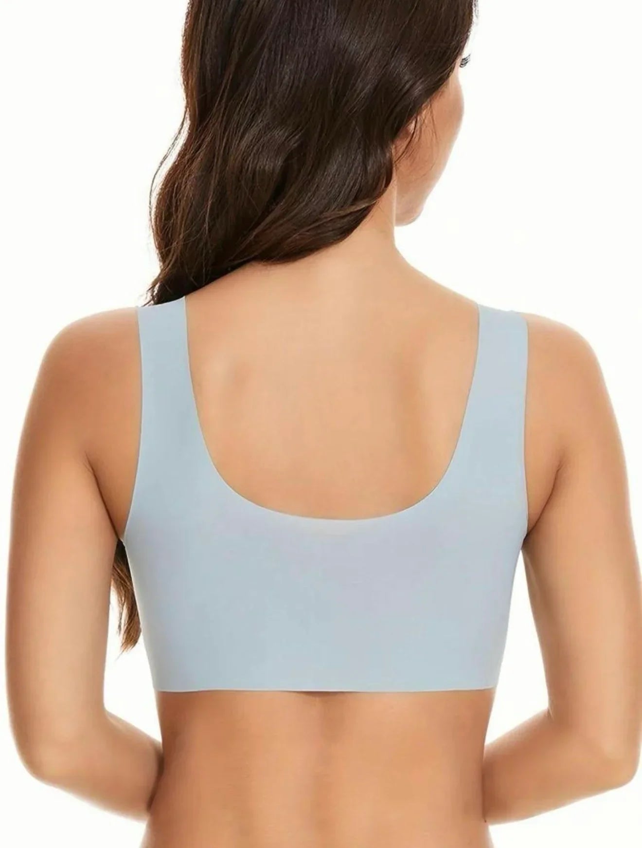 Back view of woman wearing seamless light blue comfort bra, soft undergarment for everyday wear