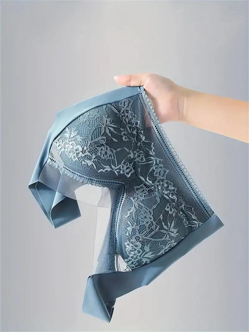 Hand holding a soft, breathable lace bra in light blue, designed for everyday comfort and elegance.